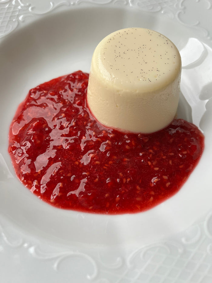 Vanilla bean panna cotta fresh raspberry coulis