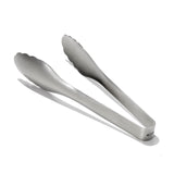 Metallic tongs on a white background
