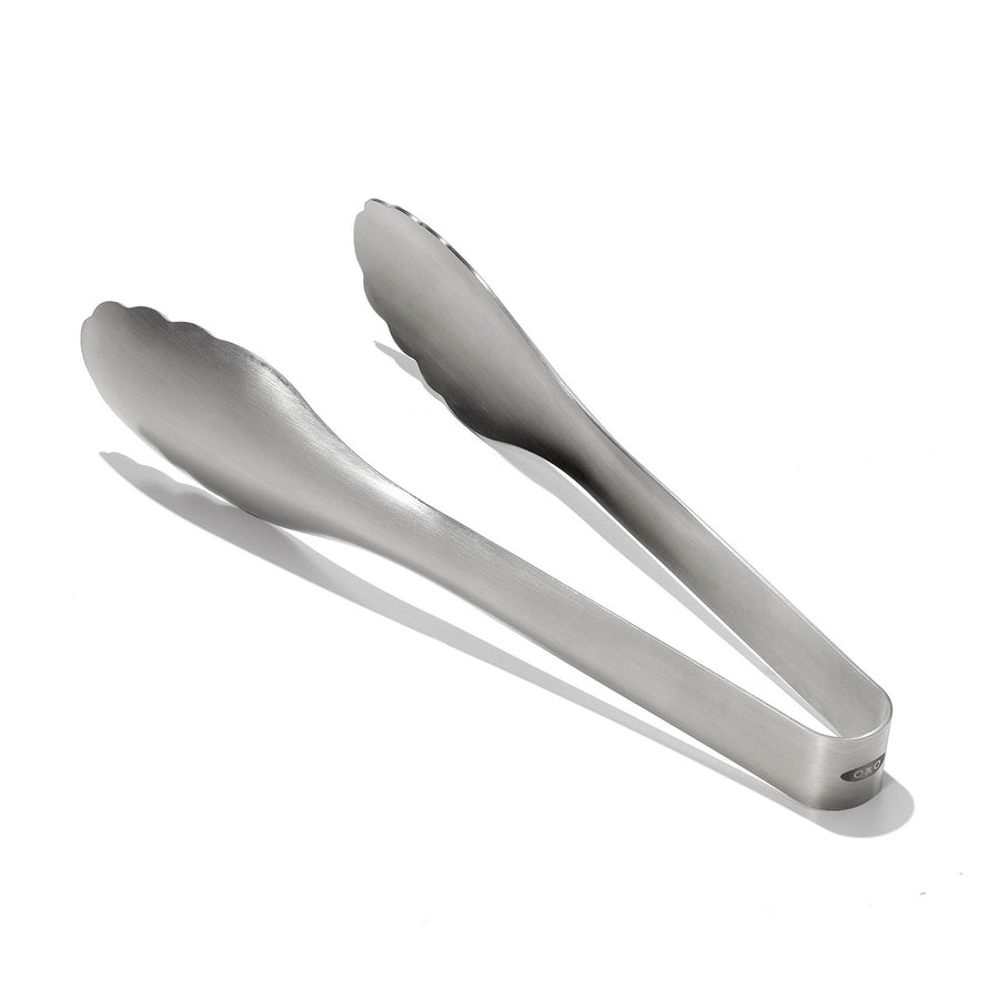 Metallic tongs on a white background